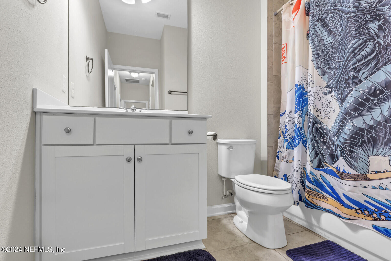 364 Beale Avenue St. Augustine, FL 32092 - Photo 24 of 54 a bathroom with a sink a toilet and a mirror