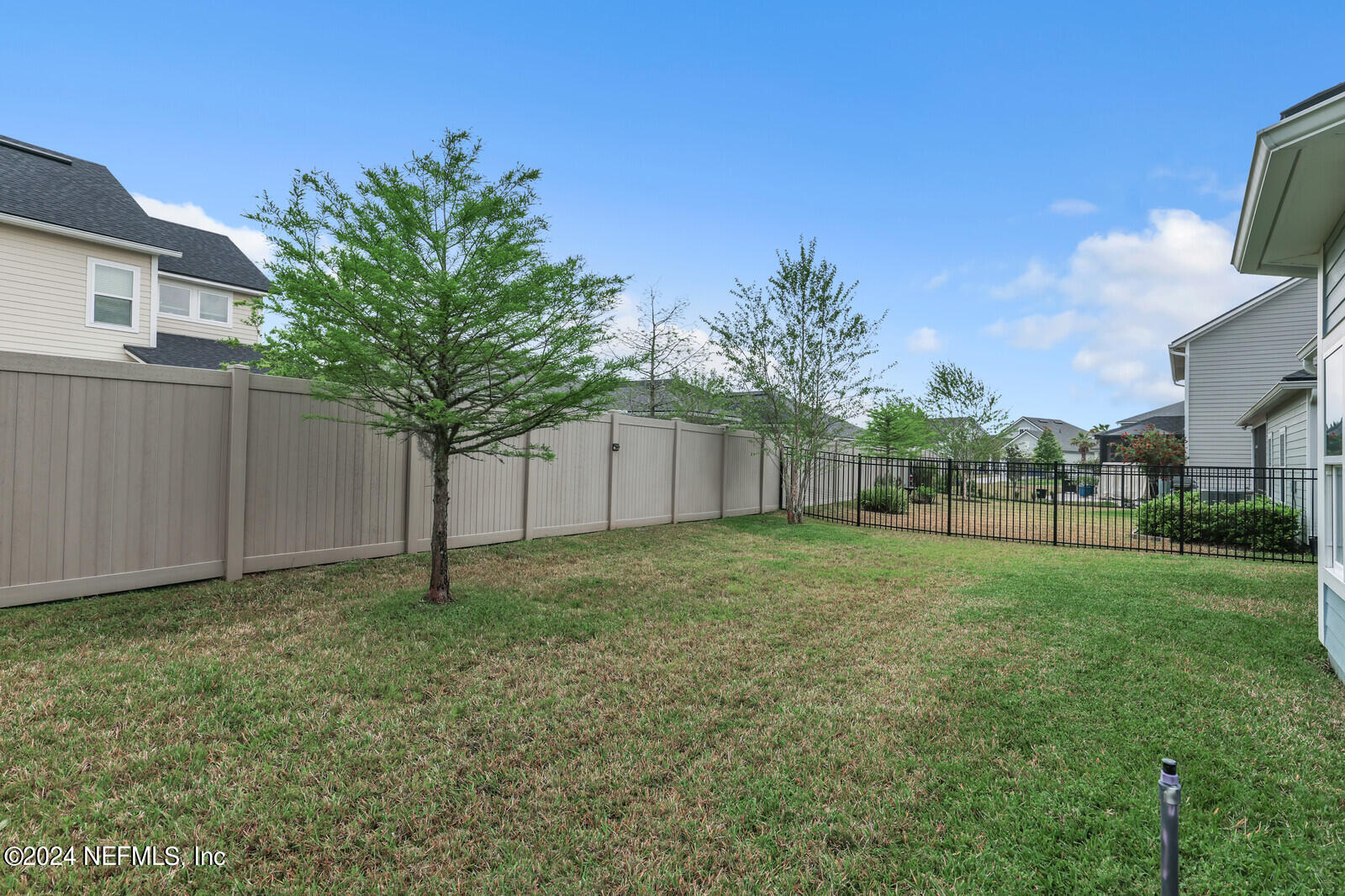 364 Beale Avenue St. Augustine, FL 32092 - Photo 35 of 54 a view of a backyard with a house and large trees