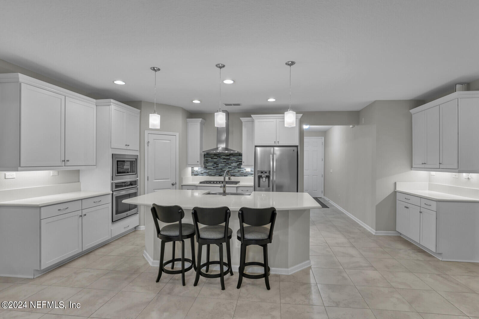 364 Beale Avenue St. Augustine, FL 32092 - Photo 8 of 54 a large kitchen with kitchen island a sink table and chairs
