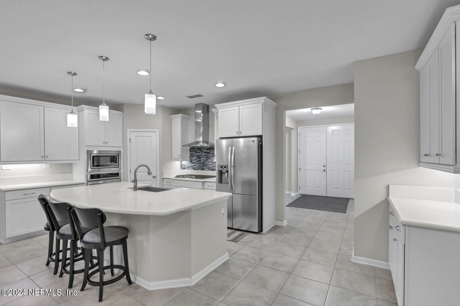 364 Beale Avenue St. Augustine, FL 32092 - Photo 9 of 54 a large kitchen with a table and chairs