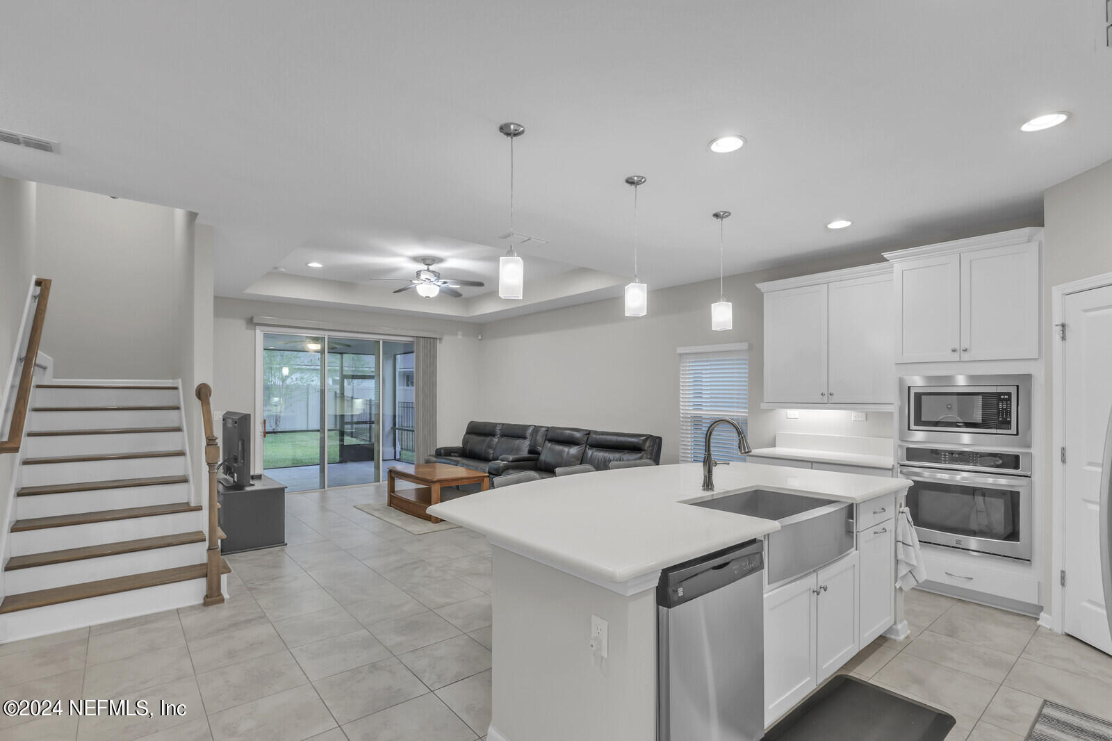 364 Beale Avenue St. Augustine, FL 32092 - Photo 10 of 54 a kitchen with stainless steel appliances kitchen island granite countertop a sink and cabinets