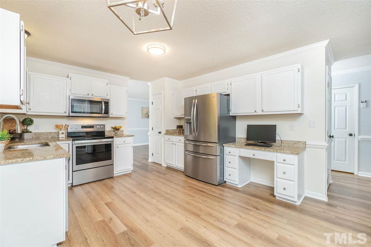 3 Bay Ridge Court Durham, NC 27713 - Photo 11 of 25 SS appliances, granite, and clean white cabinetry
