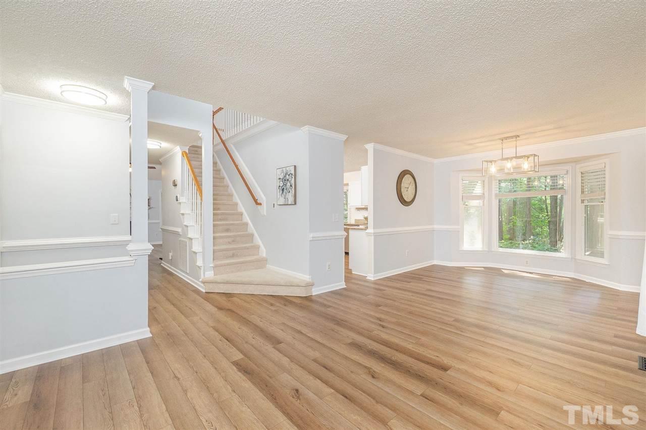 3 Bay Ridge Court Durham, NC 27713 - Photo 4 of 25 Large living/dining space with quality LVP, updated lighting, and a charming bow window has multiple uses!