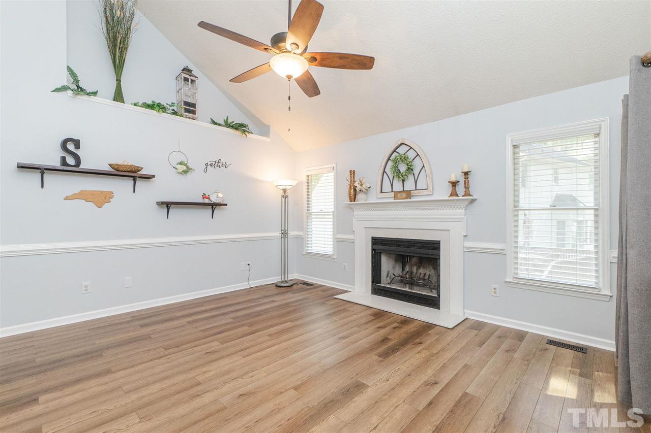 3 Bay Ridge Court Durham, NC 27713 - Photo 8 of 25 Separate family room with cozy fireplace.