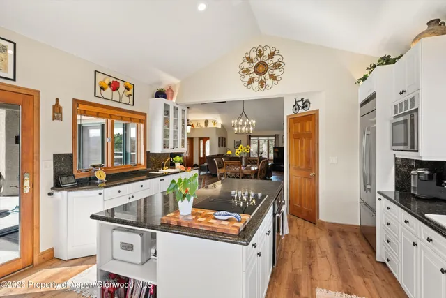 a bathroom with a sink mirror and vanity