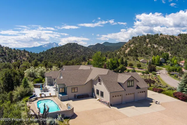 an aerial view of a house with a garden