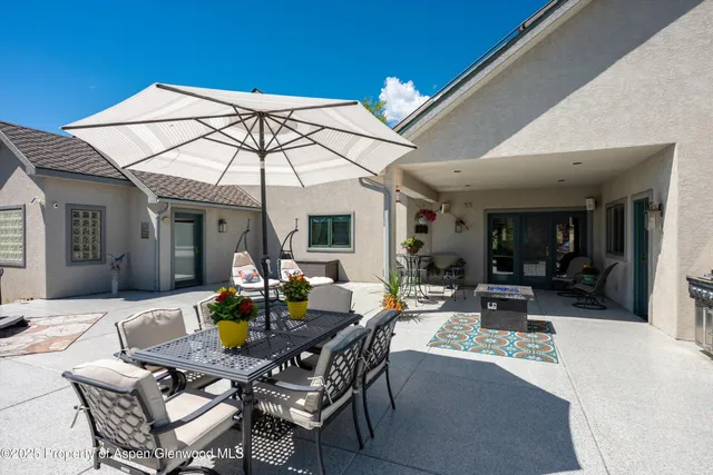 a living room with furniture and a table