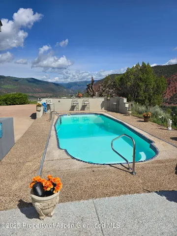 a view of a city with mountains in the background