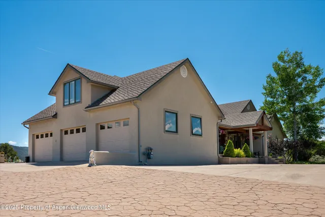 a kitchen with stainless steel appliances granite countertop a stove and a refrigerator