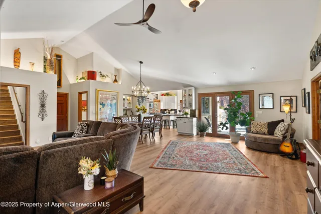 a view of a patio with table and chairs potted plants with wooden floor