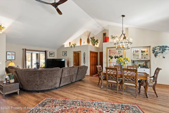 a view of a patio with table and chairs under an umbrella