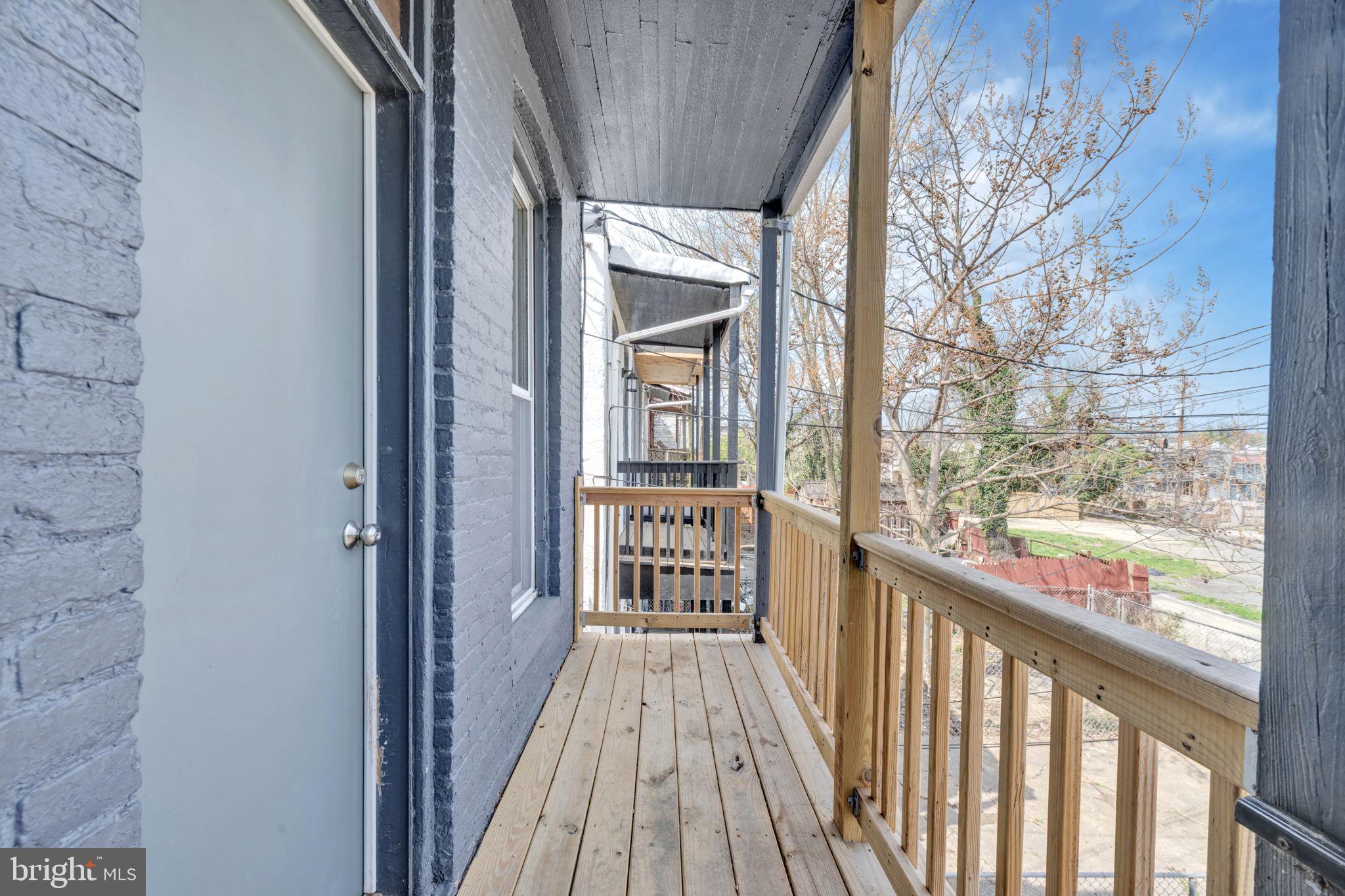 2822 Riggs Avenue Baltimore, MD 21216 - Photo 23 of 30 a view of a balcony with wooden floor