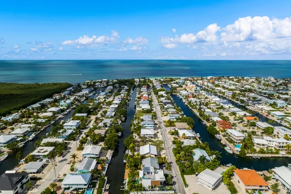 a view of a street with an ocean