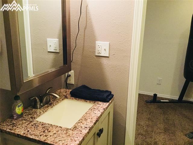 2095 Legacy Ridge View, Unit 112 Colorado Springs, CO 80910 - Photo 25 of 28 Lower bath updated fixtures.