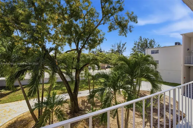 a view of a house with a tree