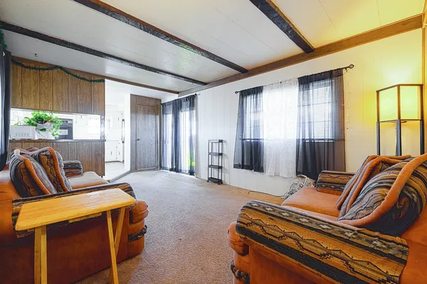 a living room with a couch and a large window