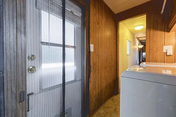 a room that has a large mirror and door