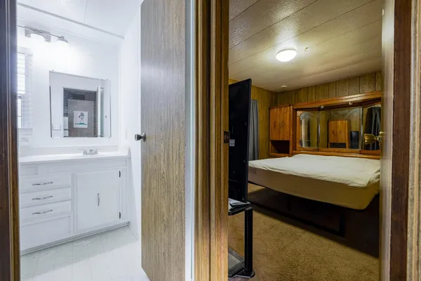 a bedroom with a bed and a dresser