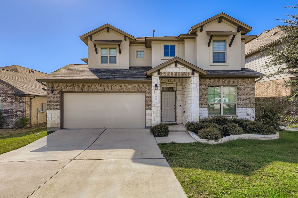 400 Somerville Street Leander, TX 78641 - Photo 1 of 11 a front view of a house with garden