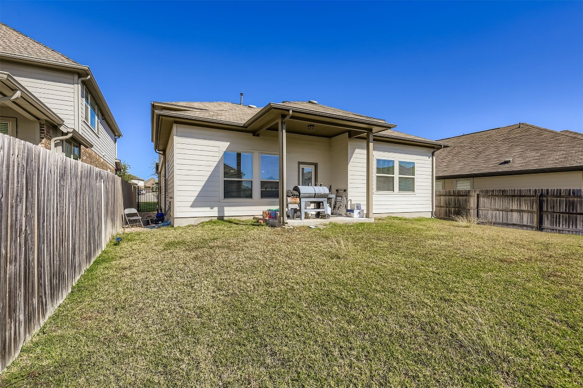 400 Somerville Street Leander, TX 78641 - Photo 11 of 11 a view of a house with wooden fence