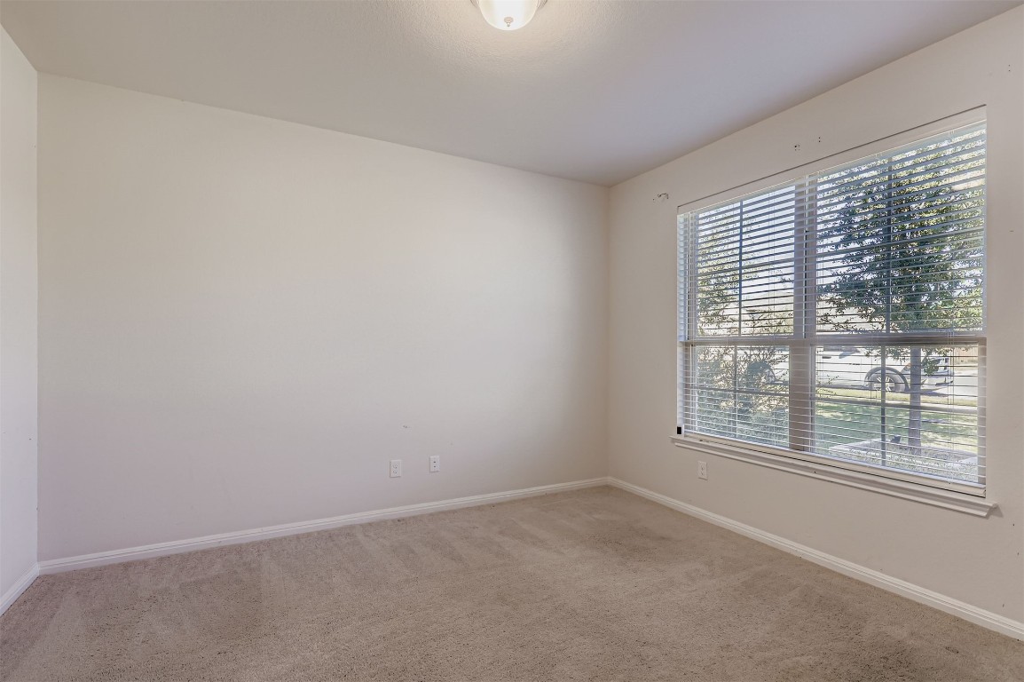 400 Somerville Street Leander, TX 78641 - Photo 3 of 11 an empty room with a window