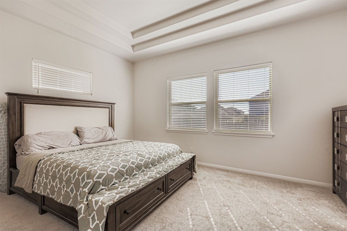400 Somerville Street Leander, TX 78641 - Photo 5 of 11 a bedroom with a large bed and a window