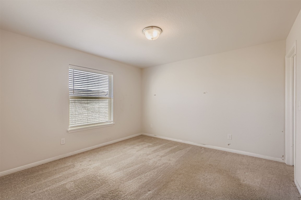 400 Somerville Street Leander, TX 78641 - Photo 7 of 11 an empty room with a window