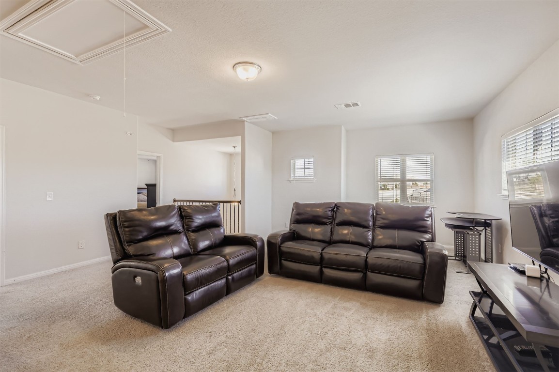 400 Somerville Street Leander, TX 78641 - Photo 10 of 11 a living room with furniture and a flat screen tv