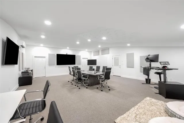 a living room with fireplace furniture and a flat screen tv