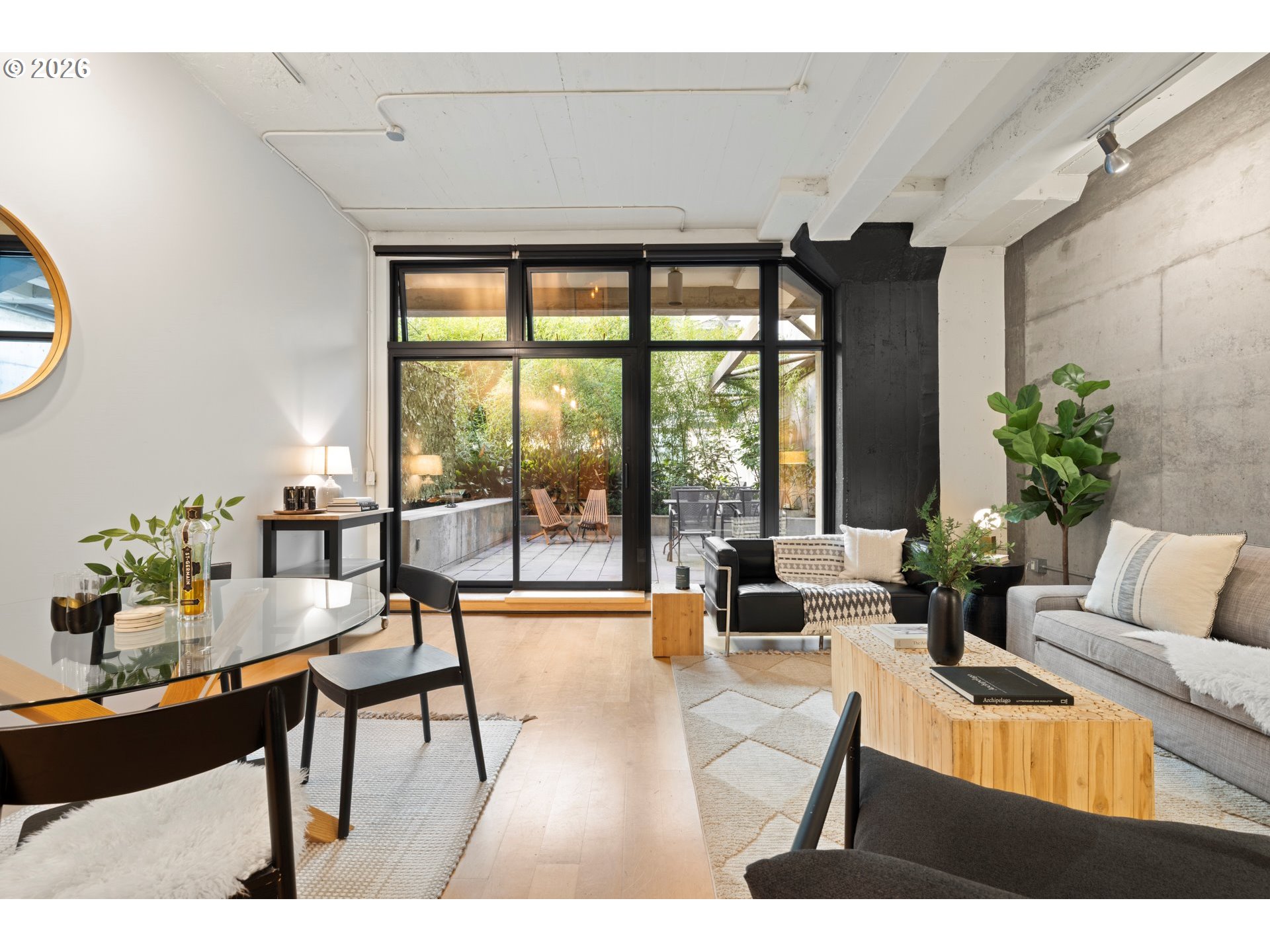 1400 Northwest Irving Street, Unit 322 Portland, OR 97209 - Photo 12 of 27 a living room with furniture and a large window