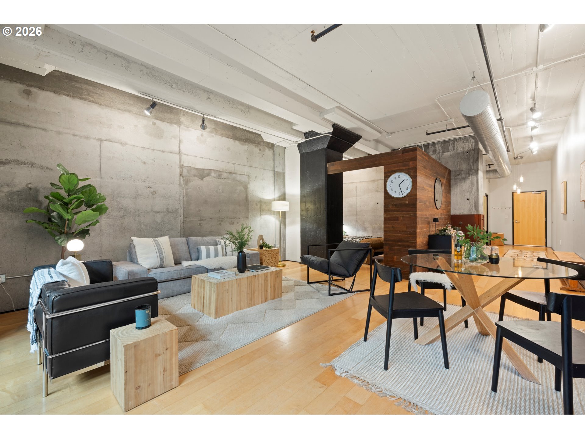 1400 Northwest Irving Street, Unit 322 Portland, OR 97209 - Photo 13 of 27 a living room with furniture and a large window