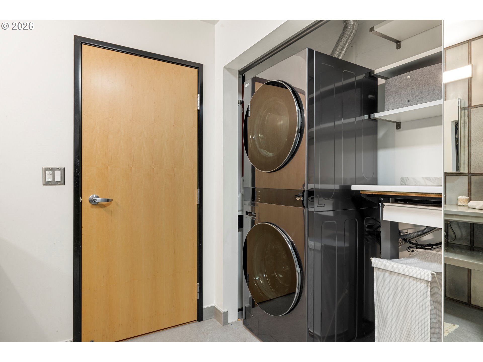 1400 Northwest Irving Street, Unit 322 Portland, OR 97209 - Photo 19 of 27 a utility room with dryer and washer
