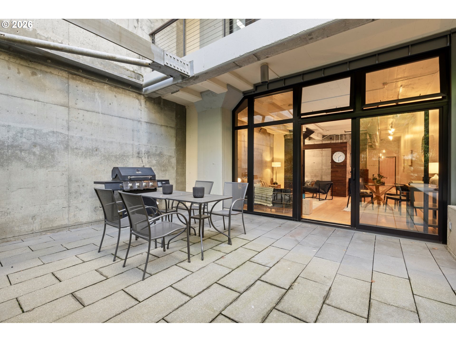 1400 Northwest Irving Street, Unit 322 Portland, OR 97209 - Photo 22 of 27 a view of a dining room with furniture window and outside view