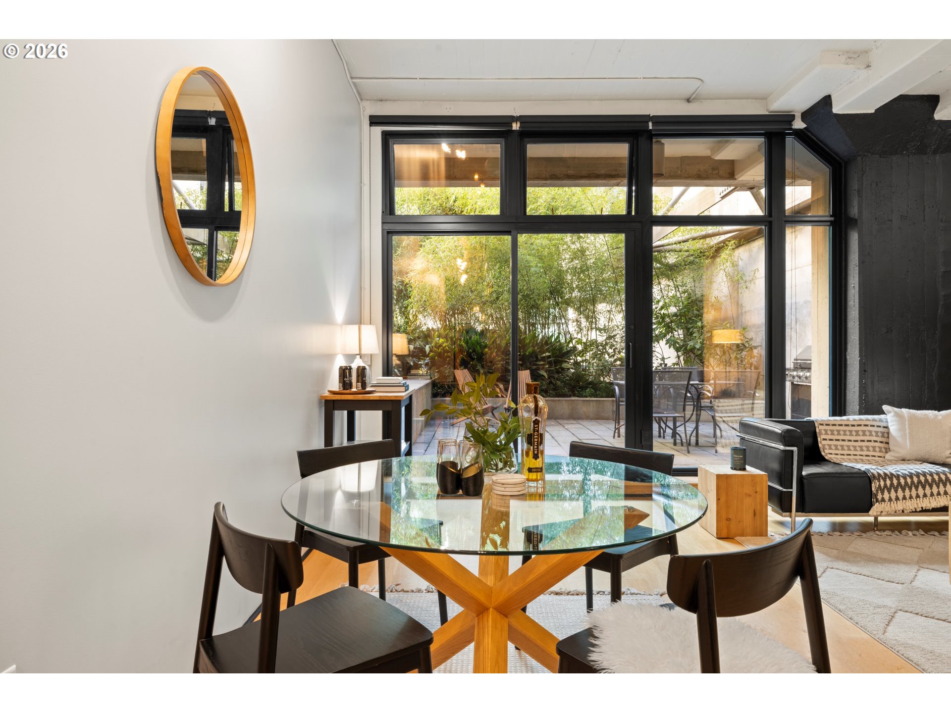 1400 Northwest Irving Street, Unit 322 Portland, OR 97209 - Photo 9 of 27 a view of a dining room with furniture and a large window