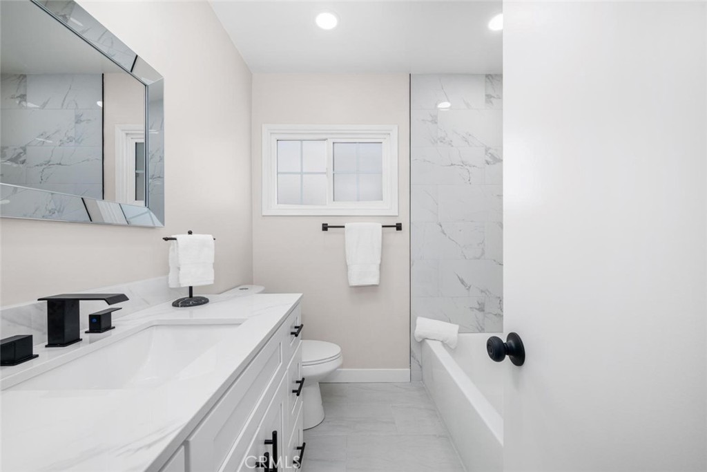 3819 North Studebaker Road Long Beach, CA 90808 - Photo 27 of 62 Guests and residents alike will appreciate the stylishly remodeled hallway bathroom.
