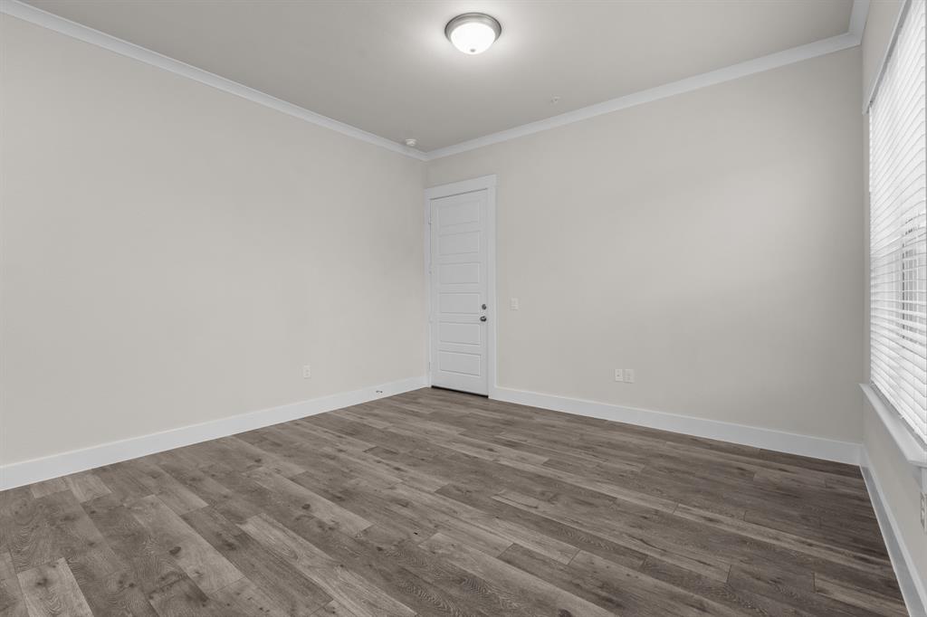 3274 Ganzer Road West, Unit 102B Denton, TX 76207 - Photo 2 of 22 wooden floor in a empty room