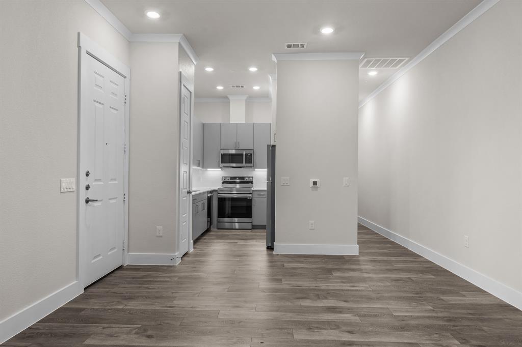 3274 Ganzer Road West, Unit 102B Denton, TX 76207 - Photo 5 of 22 a view of kitchen with wooden floor