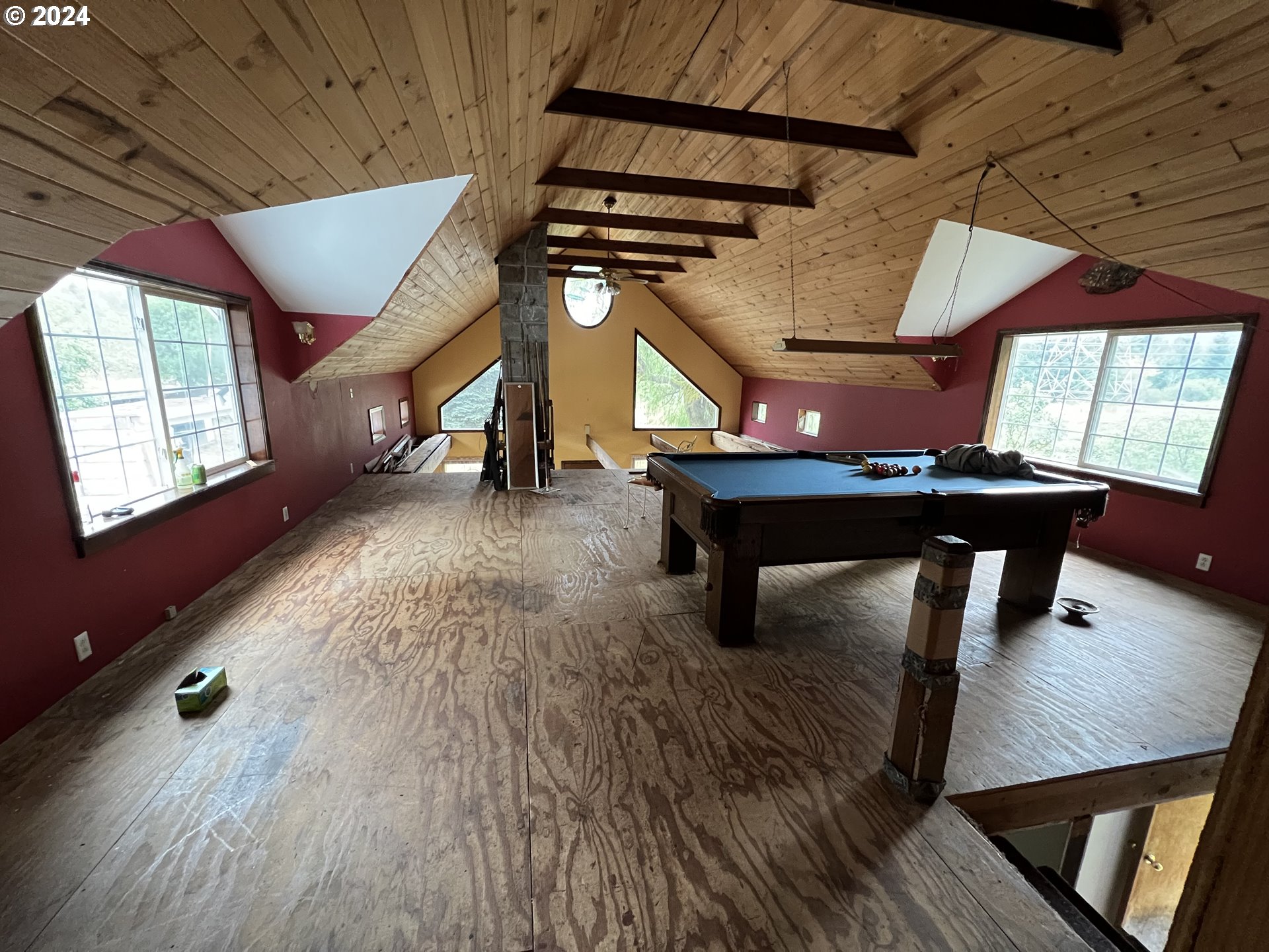 1351 Ryan-Allen Road Stevenson, WA 98648 - Photo 7 of 10 a room with lots of furniture and wooden floors