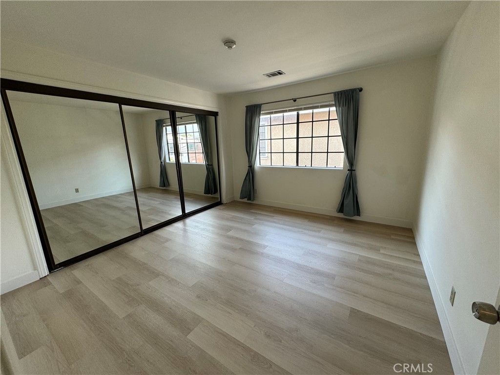 526 South Catalina Avenue, Unit C Redondo Beach, CA 90277 - Photo 17 of 29 a view of empty room with wooden floor and fan