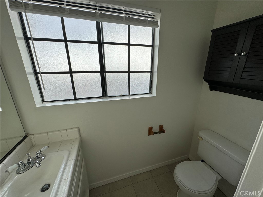 526 South Catalina Avenue, Unit C Redondo Beach, CA 90277 - Photo 18 of 29 a bathroom with a sink and a toilet