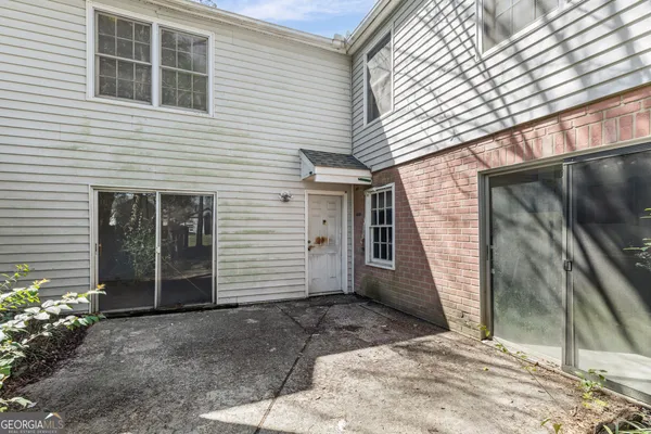 a view of a house with a door and wooden floor