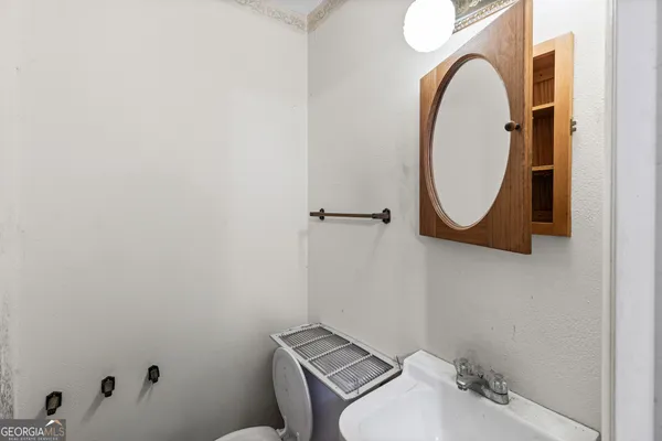 a bathroom with a sink and a mirror