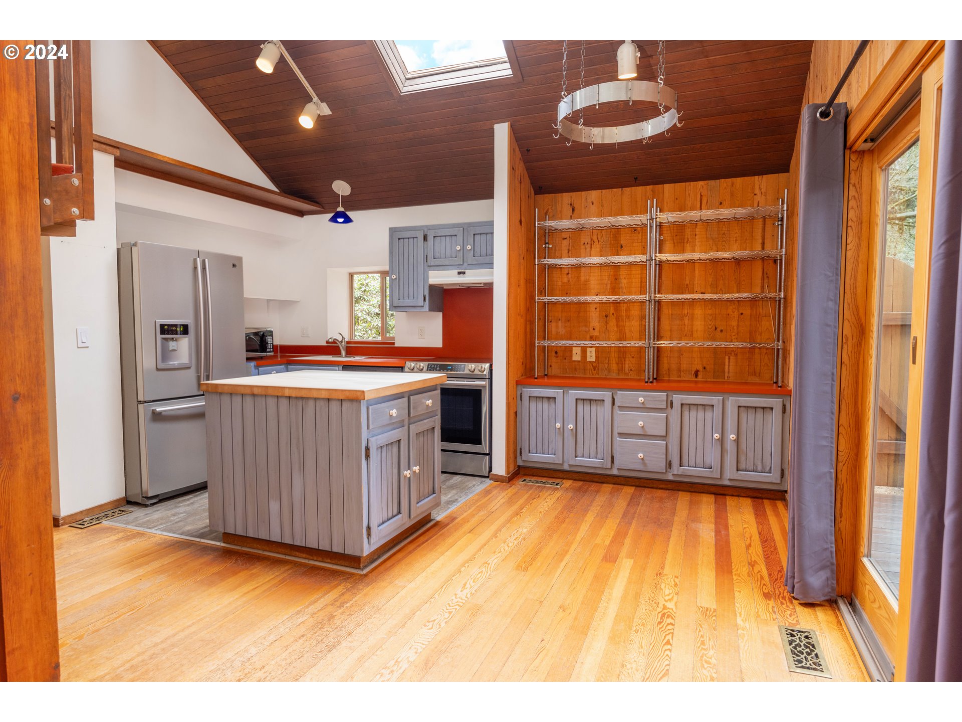 39281 Jasper Lowell Road Lowell, OR 97452 - Photo 3 of 37 a kitchen with stainless steel appliances kitchen island granite countertop a sink and wooden cabinets