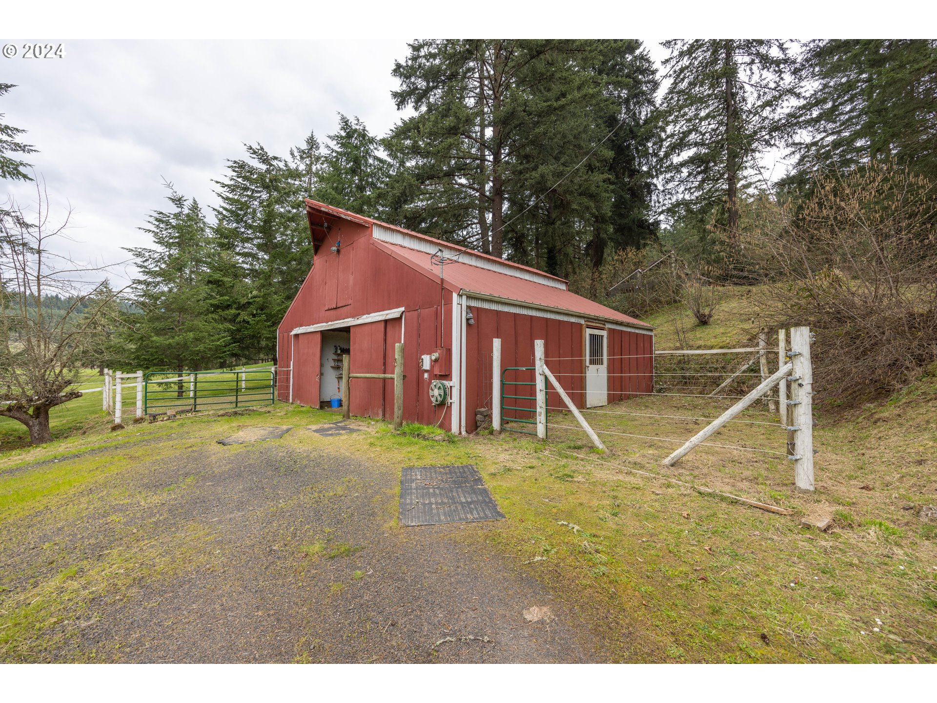 39281 Jasper Lowell Road Lowell, OR 97452 - Photo 34 of 37 a view of a yard in front of a house with a garden
