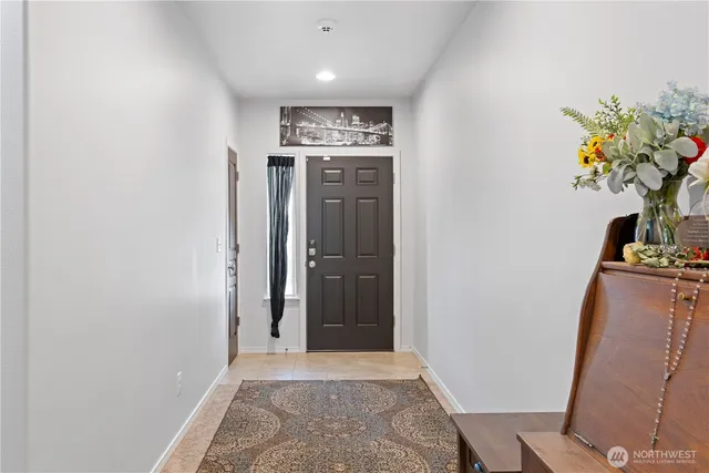 a view of a hallway with a flower pot