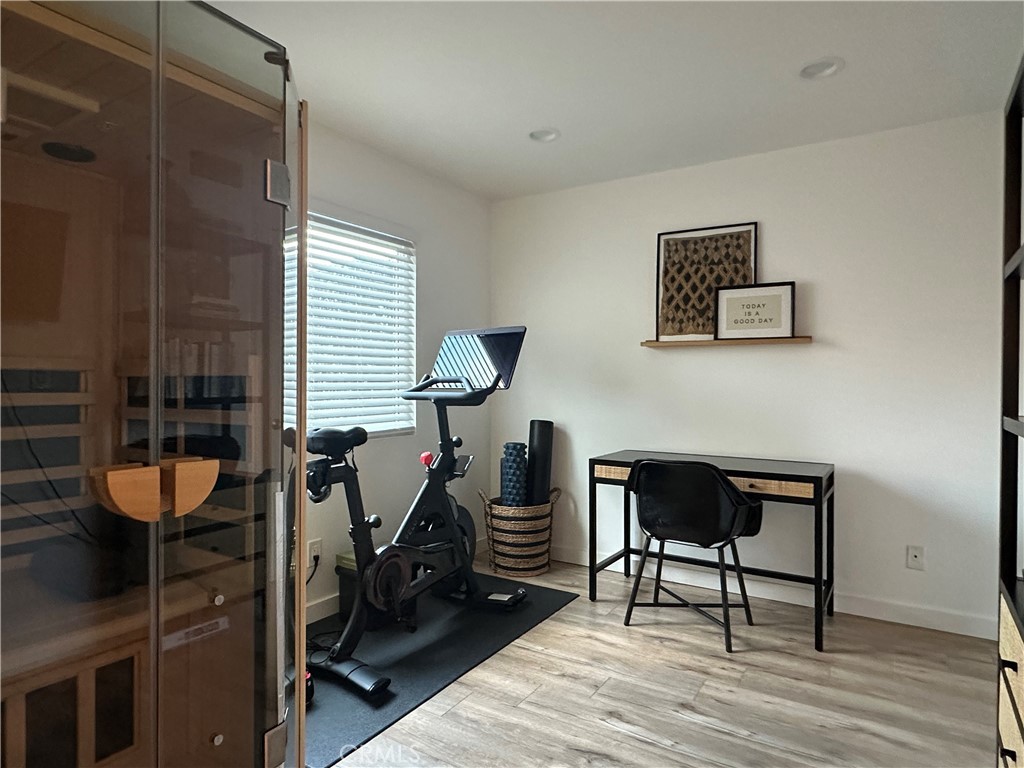 12100 Montecito Road Los Alamitos, CA 90720 - Photo 11 of 25 a view of a workspace with furniture and a window