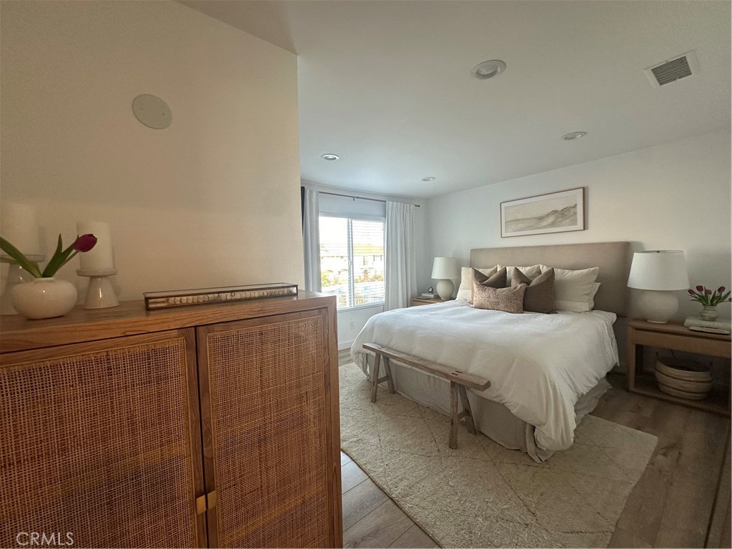 12100 Montecito Road Los Alamitos, CA 90720 - Photo 14 of 25 a bedroom with a bed and window