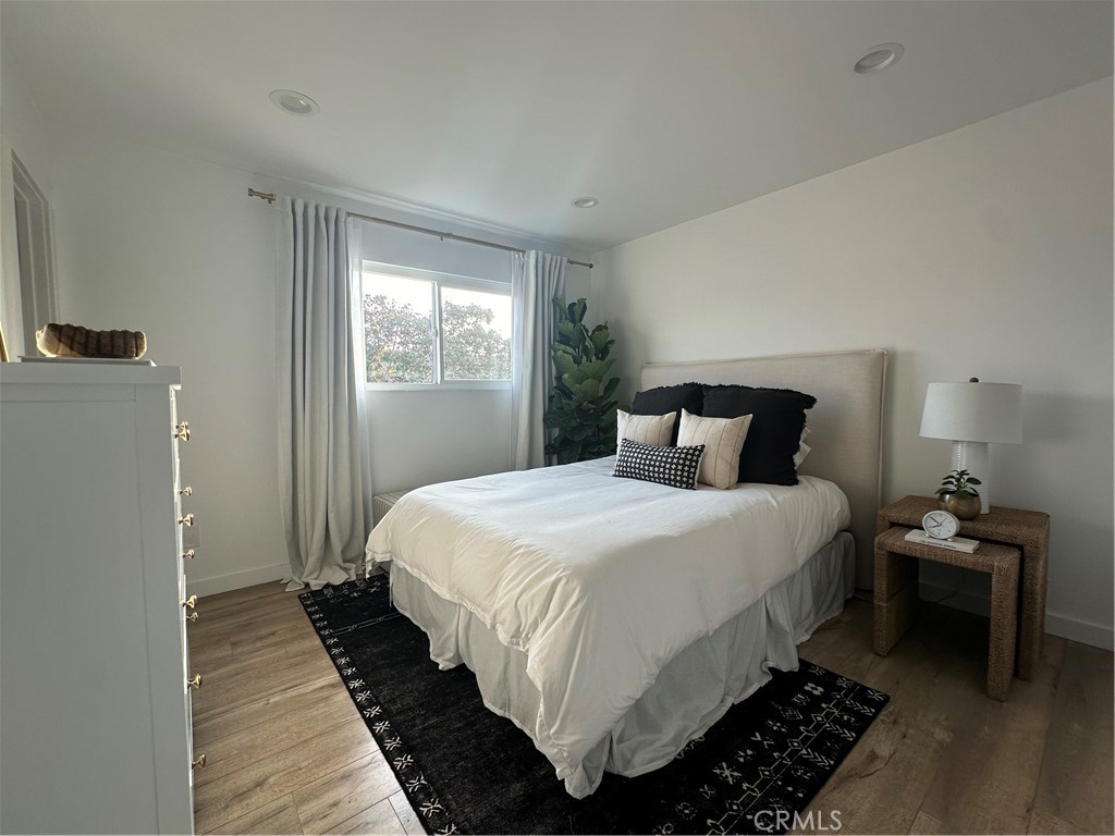 12100 Montecito Road Los Alamitos, CA 90720 - Photo 20 of 25 a bedroom with bed and window