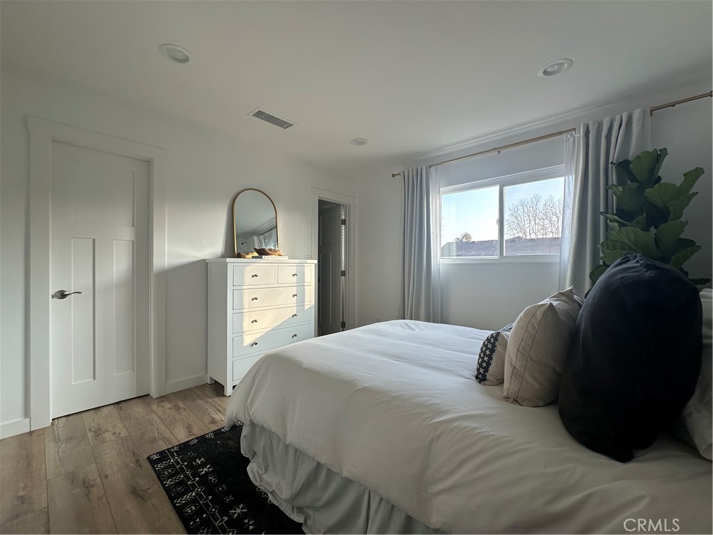 12100 Montecito Road Los Alamitos, CA 90720 - Photo 21 of 25 a bedroom with a bed and window