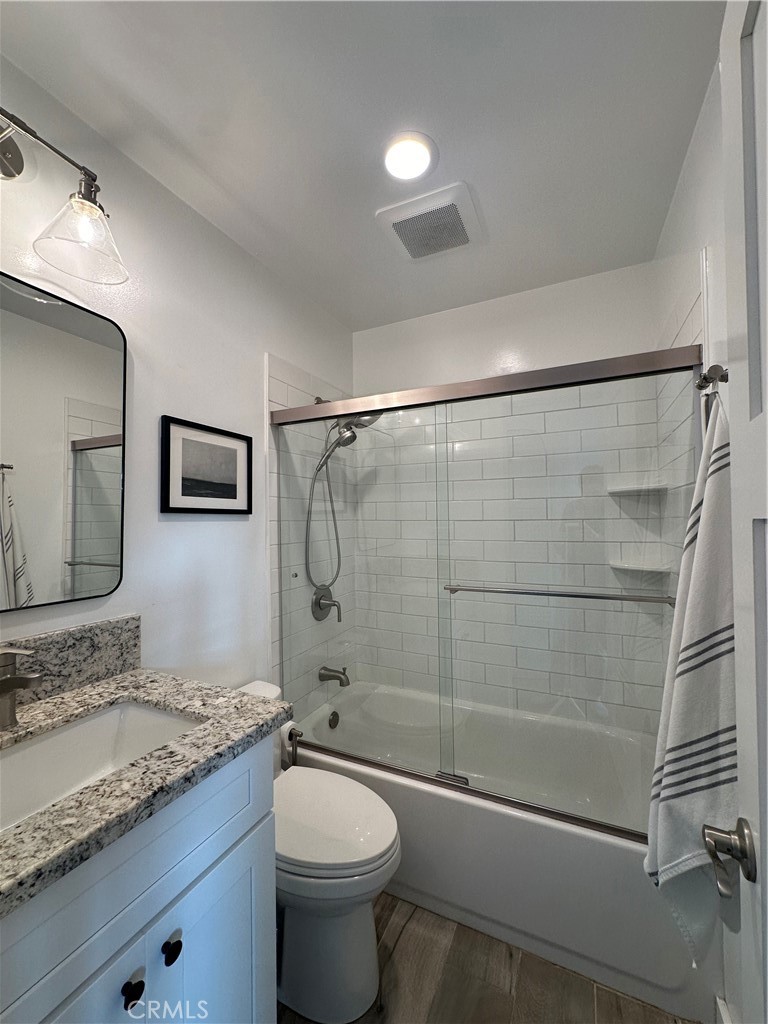 12100 Montecito Road Los Alamitos, CA 90720 - Photo 23 of 25 a bathroom with a granite countertop sink toilet and shower